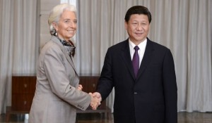 Chinese President Xi Jinping (R) shakes hands with Christine Lagarde (L), Managing Director of the International Monetary Fund (IMF), during the Boao Forum for Asia in Boao in south China's Hainan province on Monday, April 8, 2013.(Photo By Liao Pan/Color China Photo/AP Images)