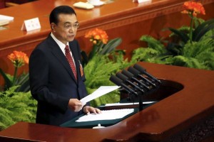 China's Premier Li Keqiang gives a speech during the opening session of the National People's Congress in Beijing