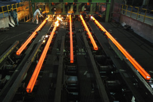 Employees work at a workshop of Hangzhou Iron and Steel Group Company in Hangzhou